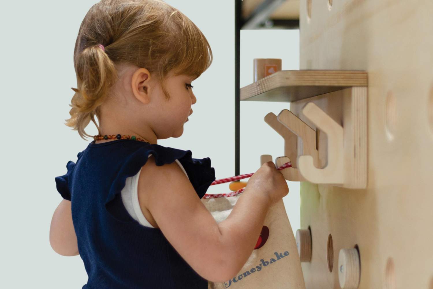 wood and steel roll play Hub with open shelving